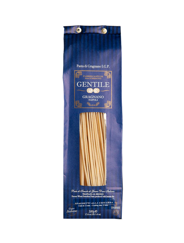 Packaged Gentile Pasta di Gragnano IGP - Spaghetti all Chitarra in a clear plastic bag with a blue and gold label, branded as 'Gentile' with the name 'Chitarra di Gragnano' and indicating the product is an IGP.
