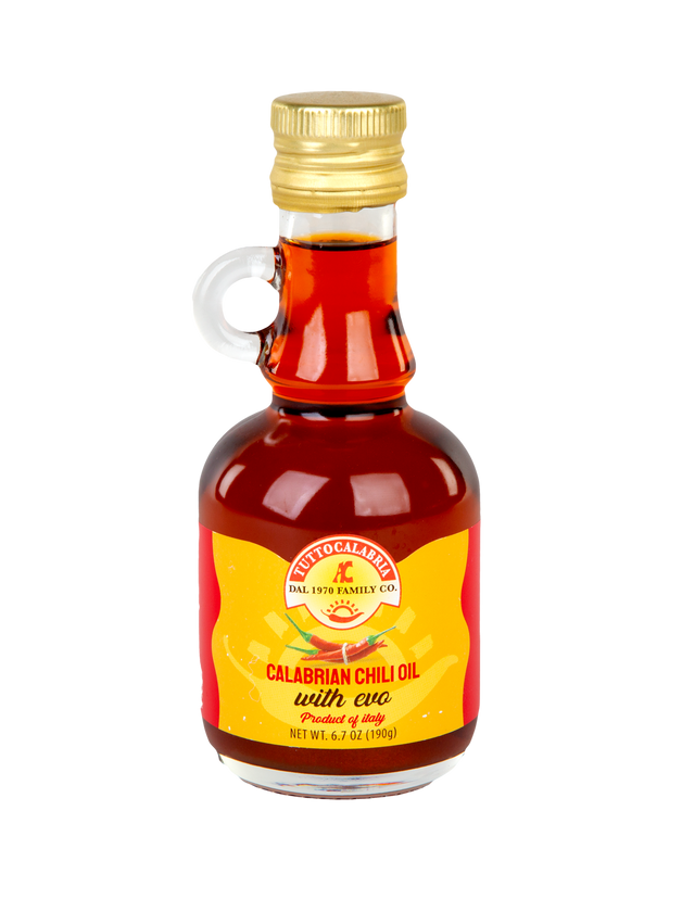 Bottle of Calabrian Chilli Oil with a yellow label on a white background